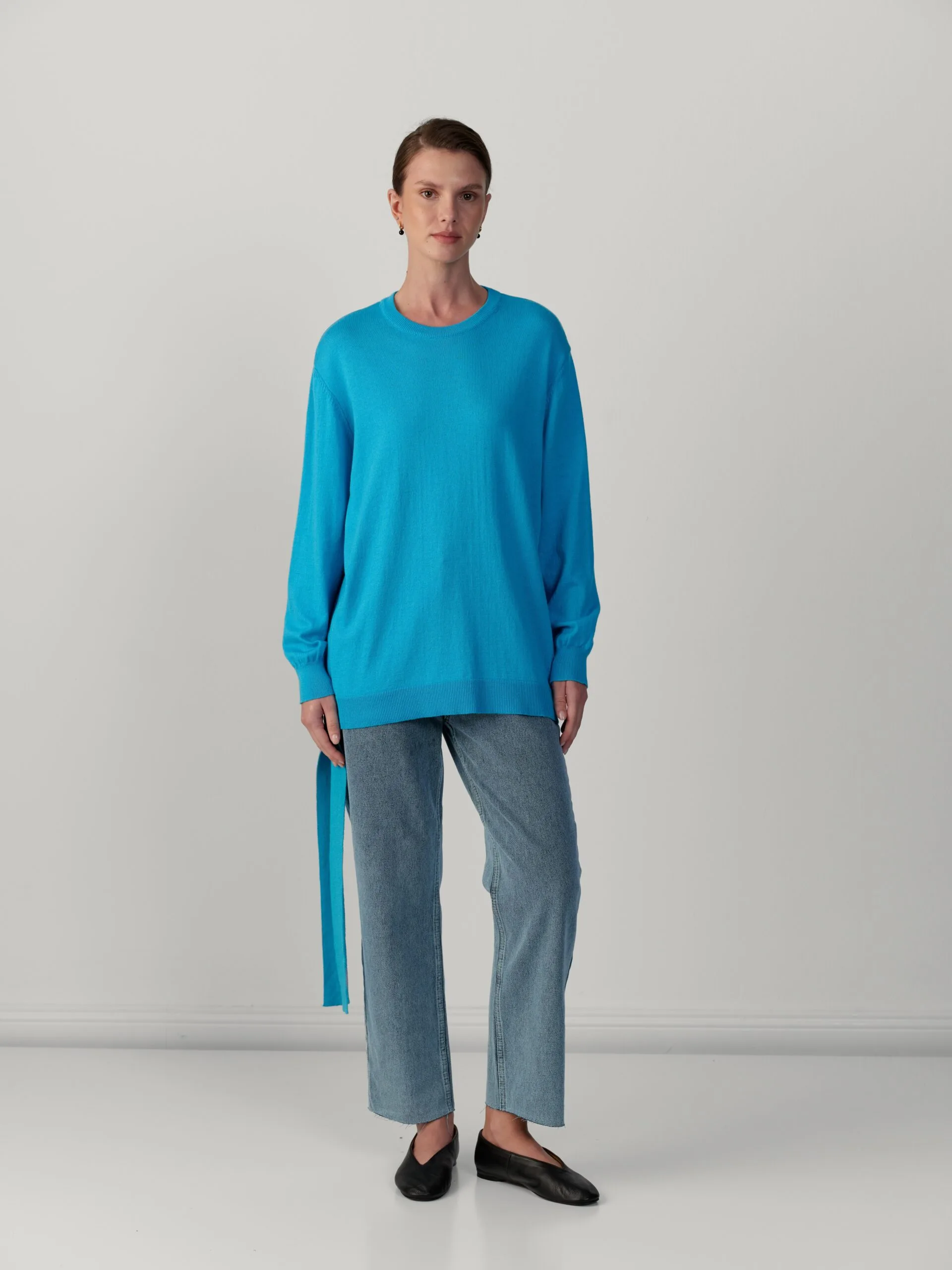 Gebreide top met strik opzij – turquoise Gebreide top met strik opzij – turquoise